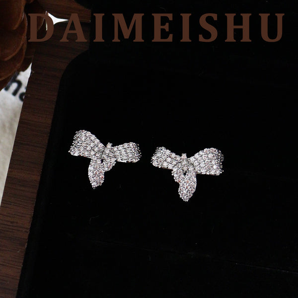 Delicate micro-inlaid zircon bow stud earrings, high-end silver needle earrings.