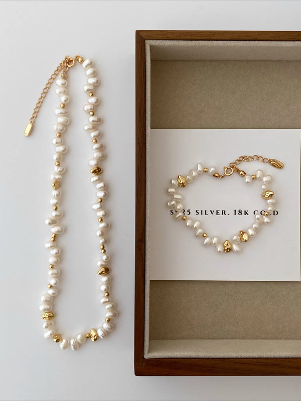 French style, scattered string of pearls